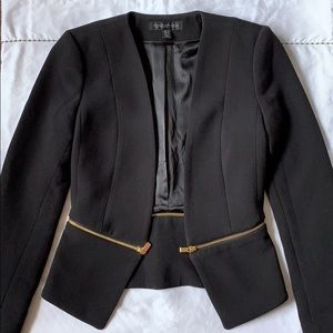 Convertible form fitting jacket with gold hardware